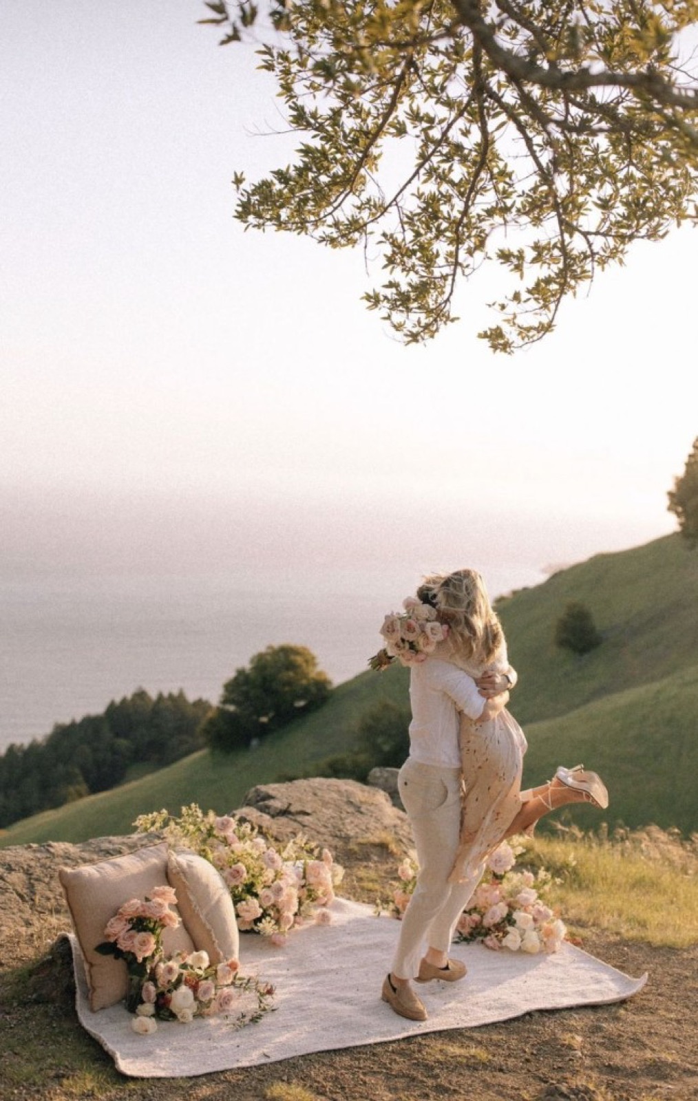 Scenic hillside proposal picnic with blush florals