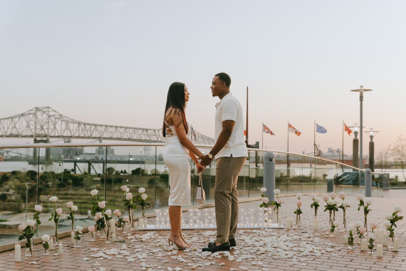 Couple at MARRY ME proposal installation by House of Avila